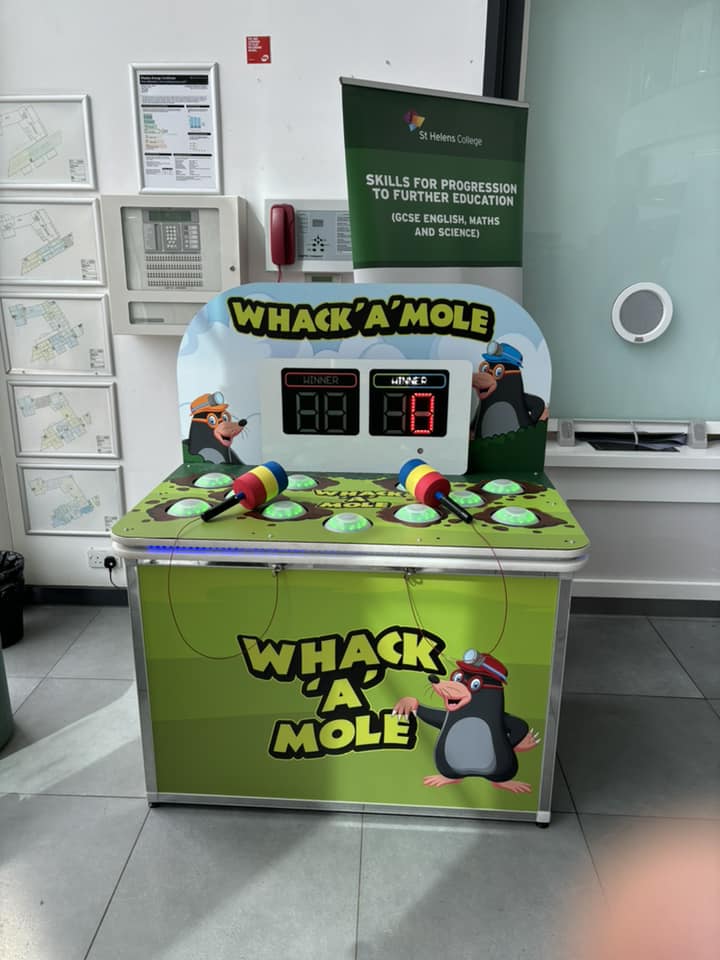 This image shows a digital whack a mole game set up at St Helens College